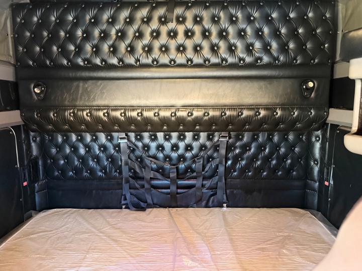 2021 Kenworth W900L 72" Raised Roof Sleeper, sleeper back wall