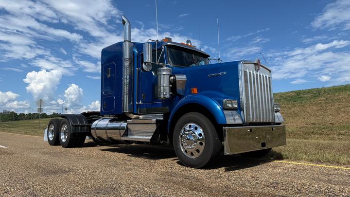 2024 Kenworth W900 62" Flat Top Sleeper, front 3/4 passenger side