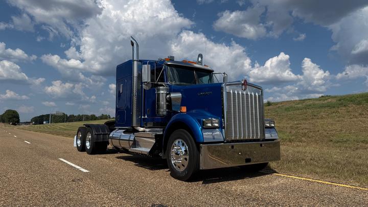 2024 Kenworth W900 62" Flat Top Sleeper, front 3/4 passenger side