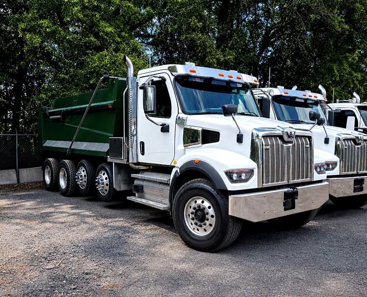 2024 Western Star 4700SF Quad Axle Dump Truck, front 3/4 with matching units