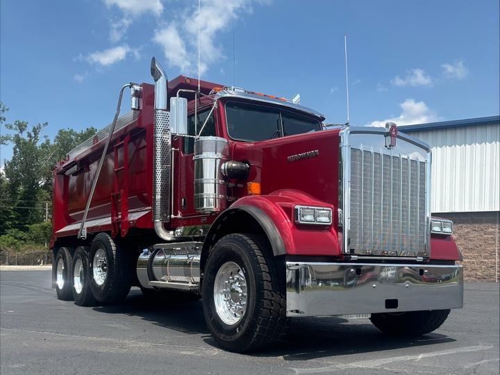 2027 Kenworth W900 Tri-Axle Dump Truck, coral red, front 3/4